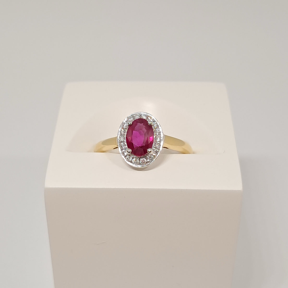 Collinsons 18ct Yellow Gold Oval Ruby and Diamond Halo Ring
